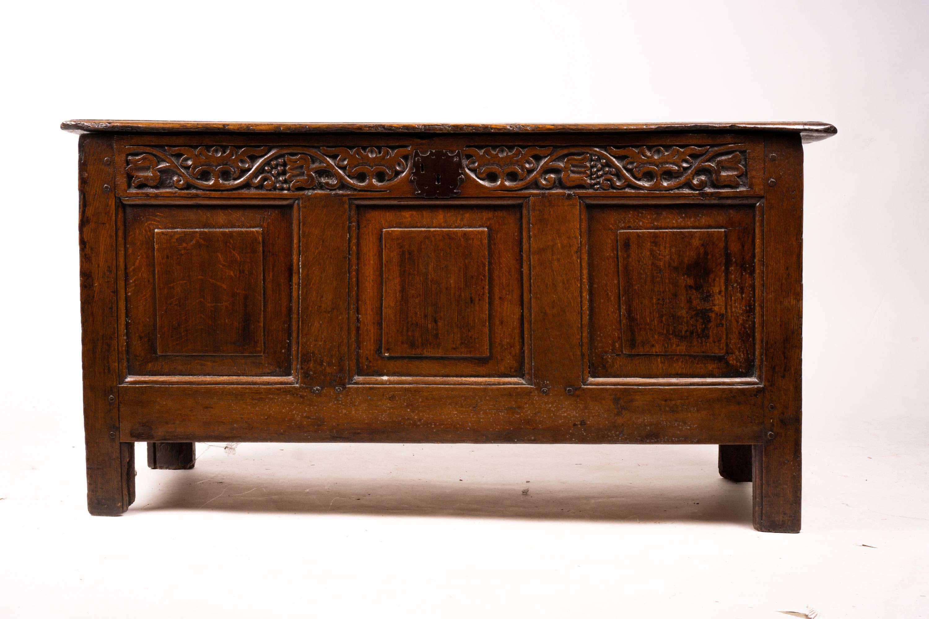 A 17th / 18th century carved oak coffer, length 132cm, depth 53cm, height 64cm